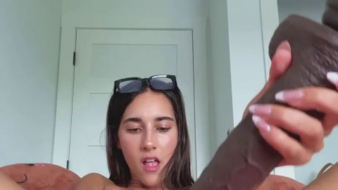 Izzy Green Solo Teases With Long Dildo